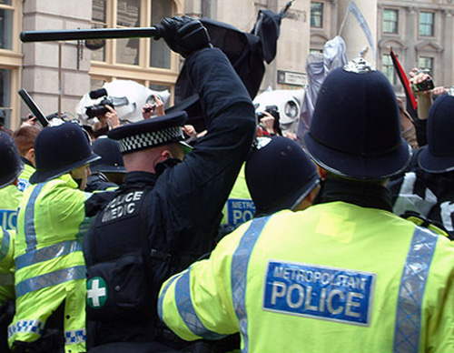 Police medic with innovative medical device, during G20 protests. Hippocratic oath, anyone?