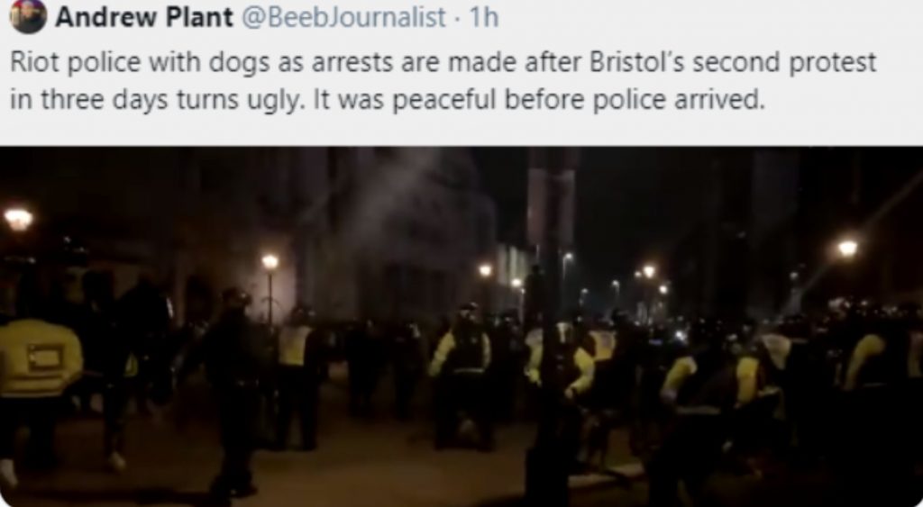 a tweet by Andrew Plant @BeebJournalist in which he says "Riot police with dogs as arrests are made after Bristol's second protest in three days turns ugly. It was peaceful before police arrived." A preview of the attached video shows a line of riot police. 